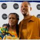 Janet Hubert hugs Will Smith after he shows up to support her at her book signing.