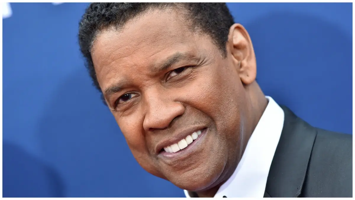 Female fans are drooling over new photos of Denzel Washington in a suit.