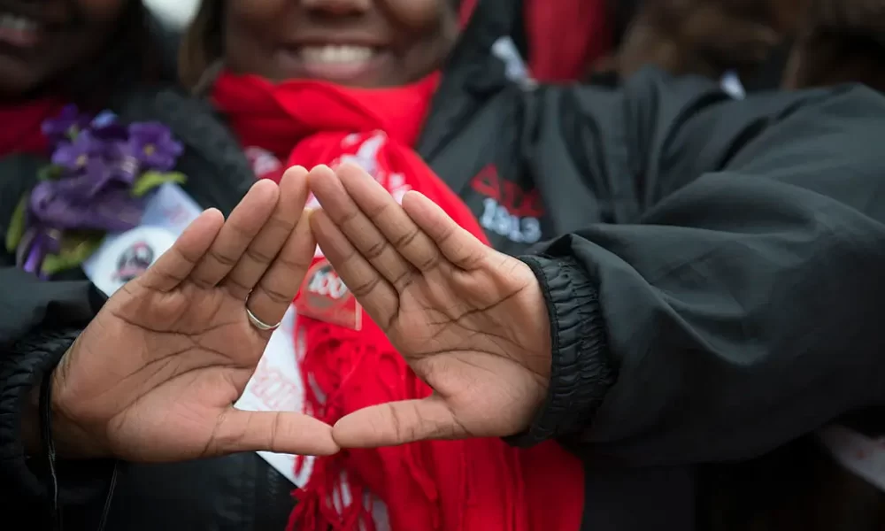 WASHINGTON DC: MARCH 03 The symbol of Delta Sigma Theta Sorority, Inc is displayed for the camera in Washington, D.C. on March 03, 2013. Deltas gathered on the West Front of the United States Capitol and then marched past the White House and finally ended their march on the grounds of the Washington Monument. Members of Delta Sigma Theta Sorority, Inc., the single largest predominantly African-American women