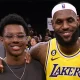 LOS ANGELES, CALIFORNIA - FEBRUARY 07: LeBron James #6 of the Los Angeles Lakers poses for a picture with his family at the end of the game, (L-R) Bronny James, Bryce James, Zhuri James Savannah James and Gloria James, passing Kareem Abdul-Jabbar to become the NBA