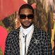 US singer Usher Raymond IV aka Usher poses during a photocall prior to the Chanel show as part of the Paris Fashion Week Womenswear Spring/Summer 2024 at the Grand Palais Ephemere in Paris on October 3, 2023. (Photo by Bertrand GUAY / AFP) (Photo by BERTRAND GUAY/AFP via Getty Images)