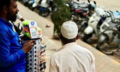 phonepe UPI being used to accept payments at a road-side sunglasses stall.