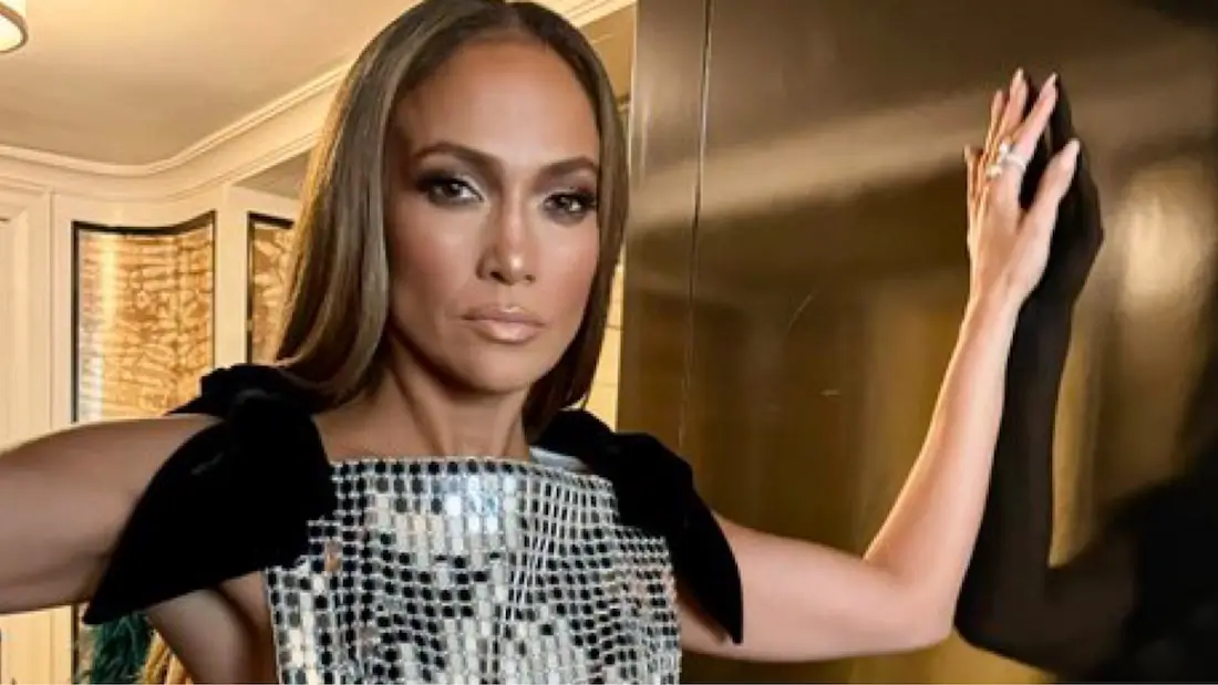 Bronx bombshell Jennifer Lopez wears a silver disco ball dress with her sides cut out at the premiere of her new movie