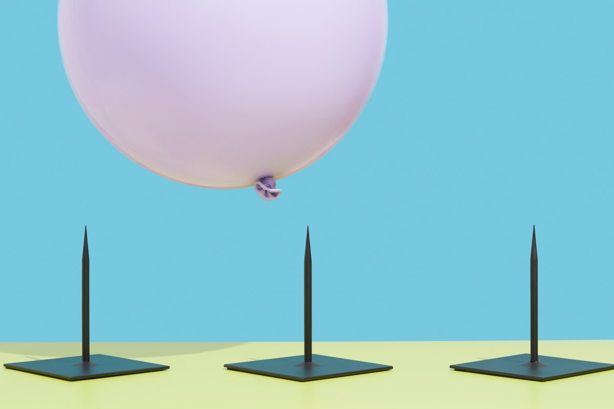 Image of a pink balloon hovering over three spikes to represent risk.