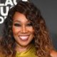 Gospel singer Yolanda Adams curve-hugging dress