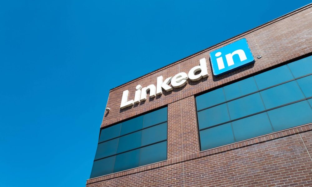 View of main building with logo and signage at the headquarters of professional social networking company LinkedIn