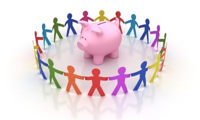 Circle of People with Piggy Bank