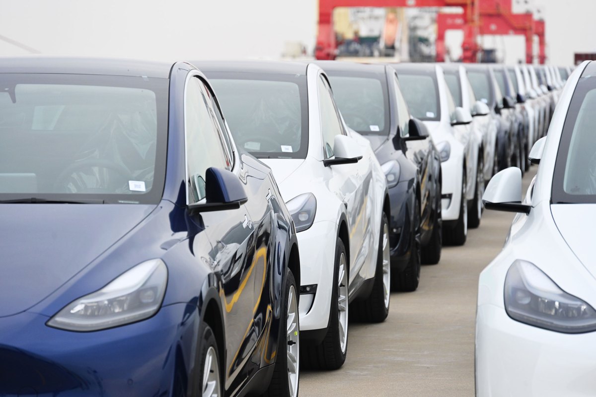 Teslas, which will be sent to the Port of Zeebrugge in Belgium, wait to be loaded on board the cargo vessel Theben operated by Wallenius Wilhelmsen at Nangang port.