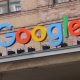 Google corporate logo hangs outside the Google Germany offices