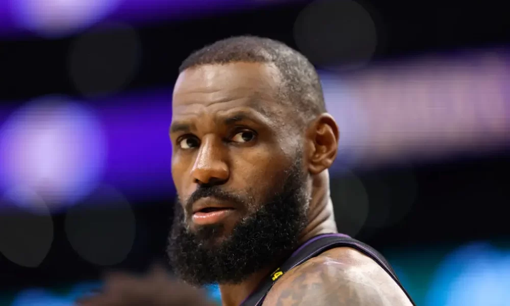 NBA All-Star Lebron James reunites with a woman in Oregon that he bumped into during a game in 2019. (Photo by Ronald Martinez/Getty Images)