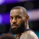 NBA All-Star Lebron James reunites with a woman in Oregon that he bumped into during a game in 2019. (Photo by Ronald Martinez/Getty Images)