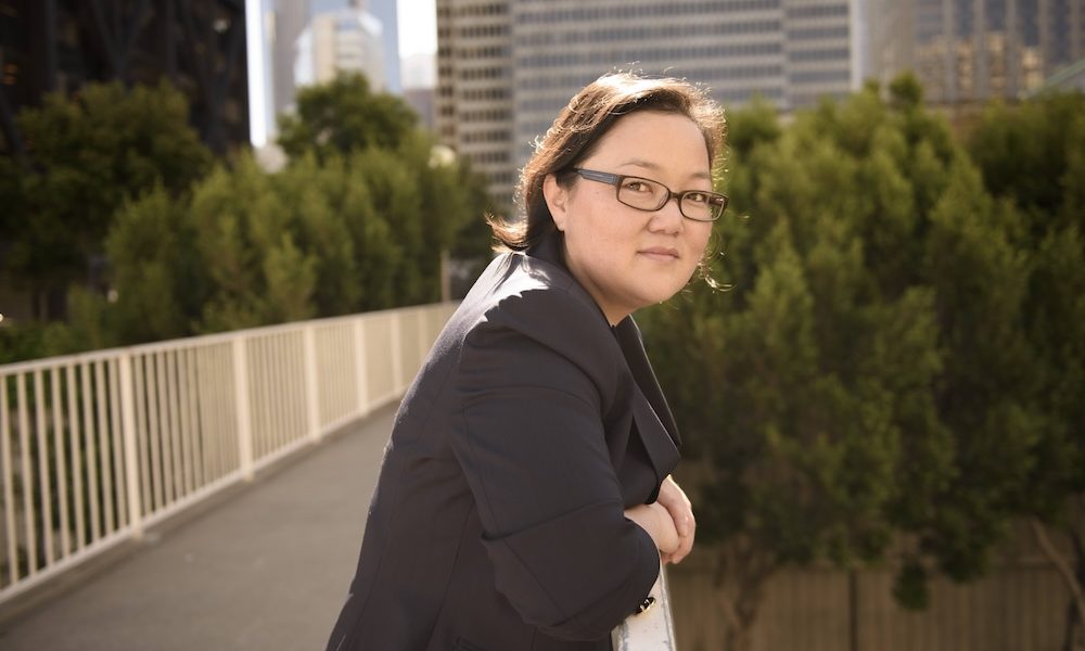 Photo of Tammy H. Nam on a bridge